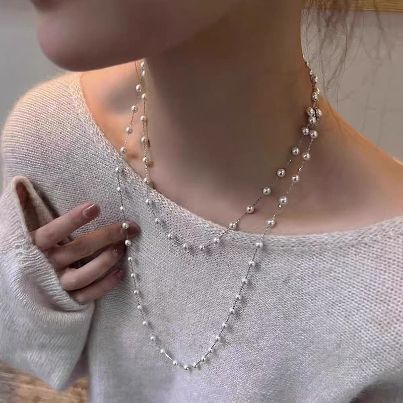 زن الصينية الجديدة قلادة من النحاس ريشة البوهيمي الرياح الوطنية للمرأة طبقة مزدوجة مطوية طويلة سترة سلسلة التبعي