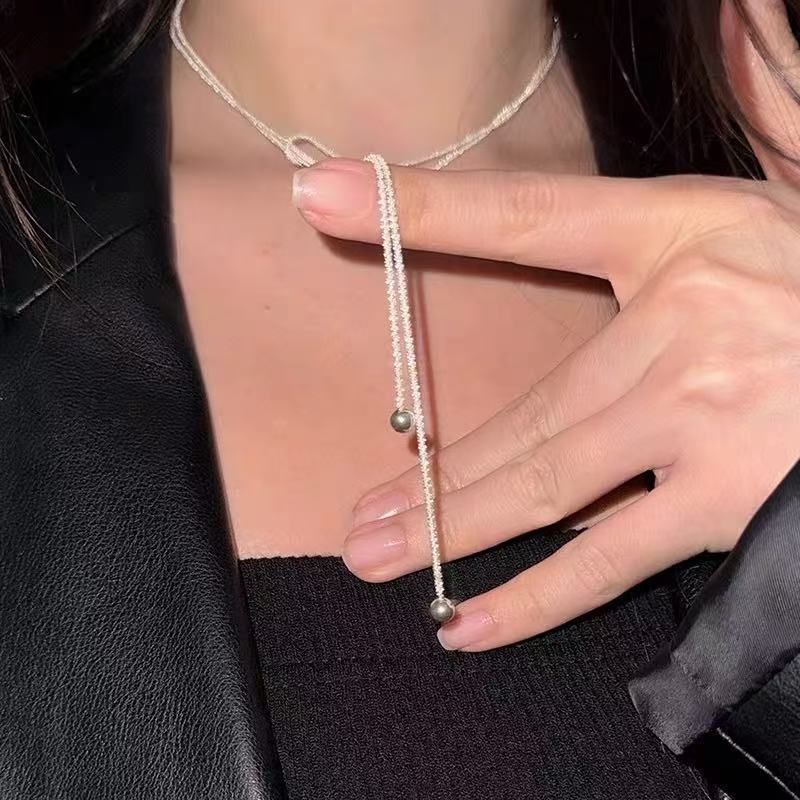 زن الصينية الجديدة قلادة من النحاس ريشة البوهيمي الرياح الوطنية للمرأة طبقة مزدوجة مطوية طويلة سترة سلسلة التبعي